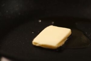 adding-butter-to-pan