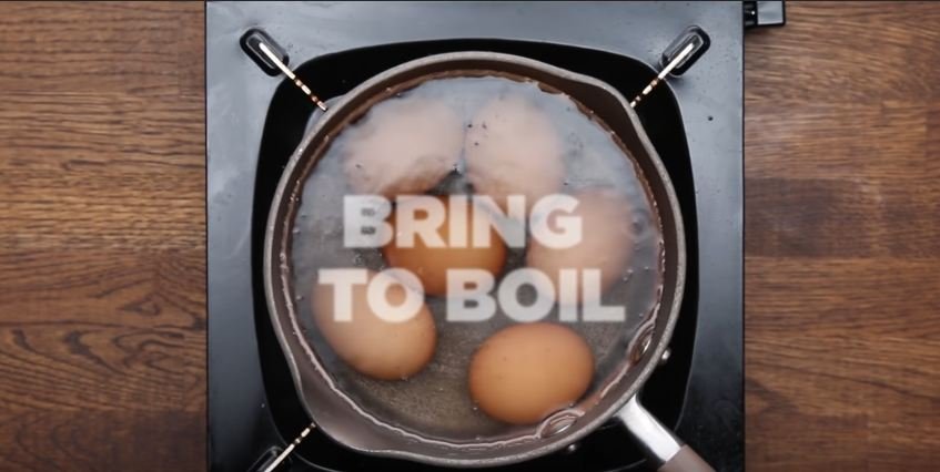 eggs boiling in a pan