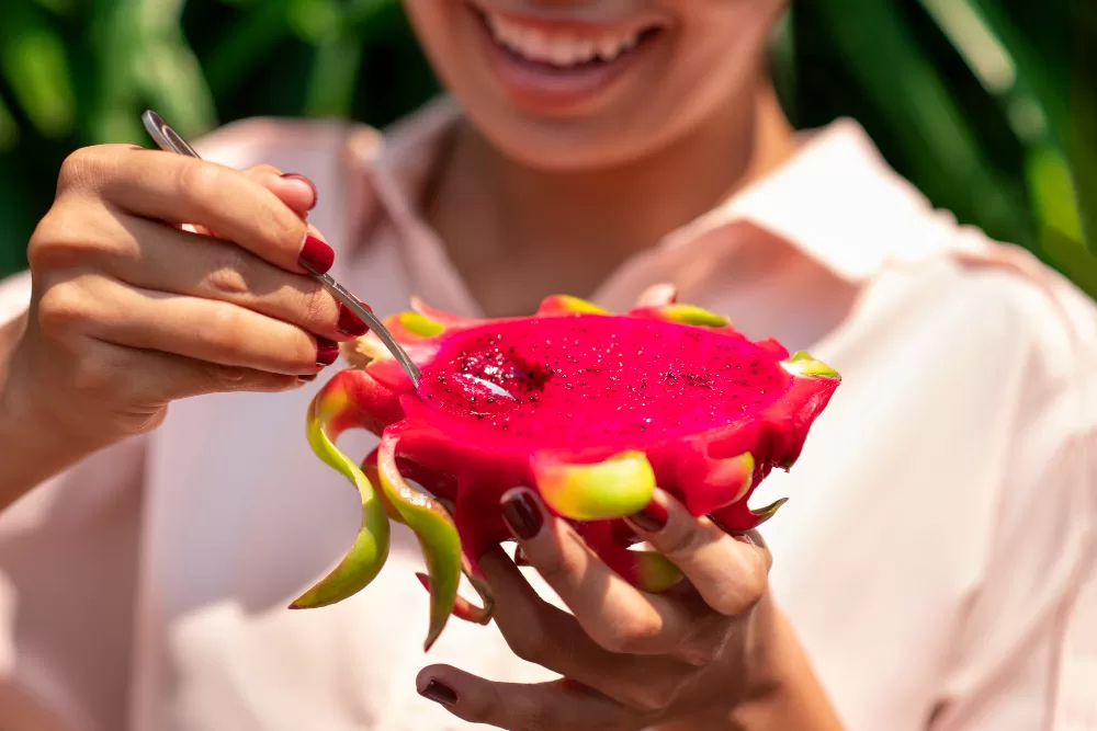 woman-outdoors-with-dragon-fruit