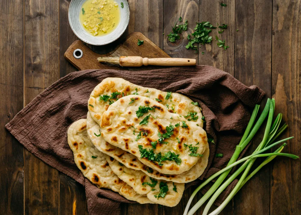 garlic naans on table