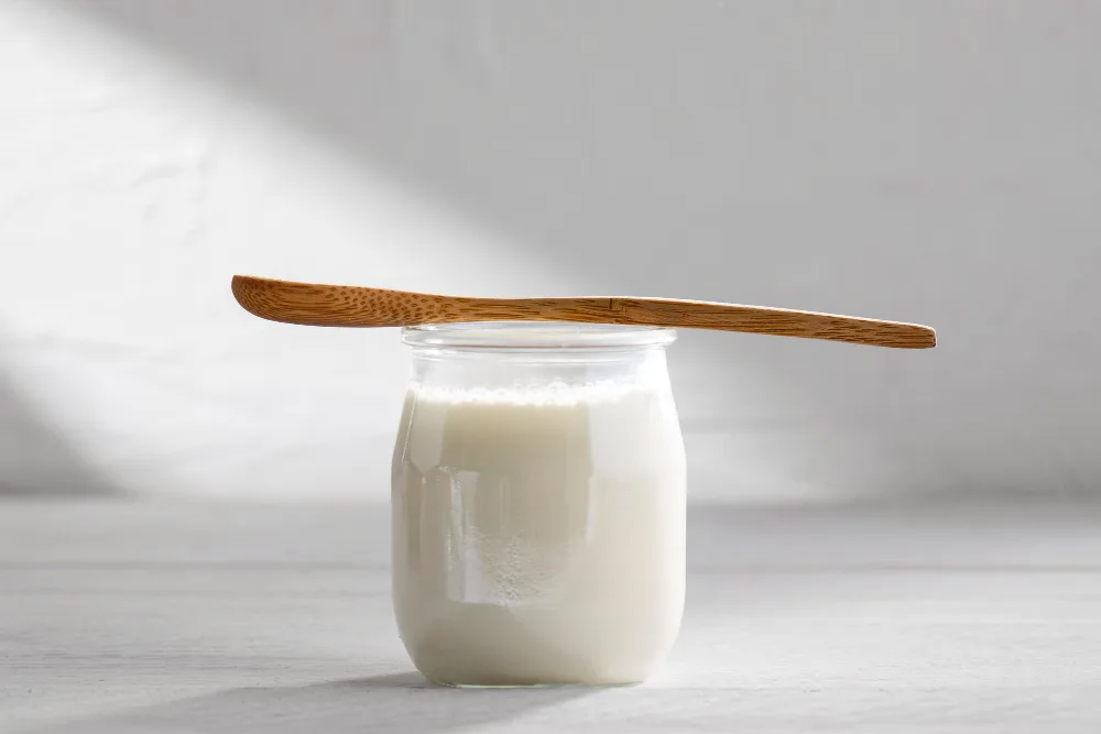 yougurt-on-a-glass-jar-and-spoon